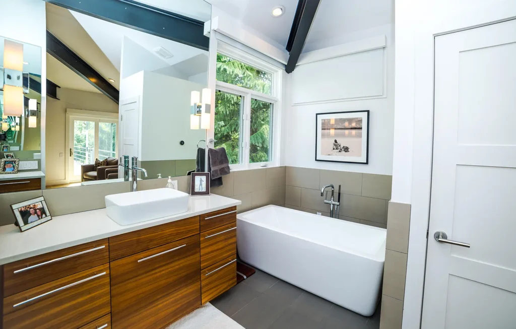 Interior bathroom of Golf Lane revealing large white tub and mirror