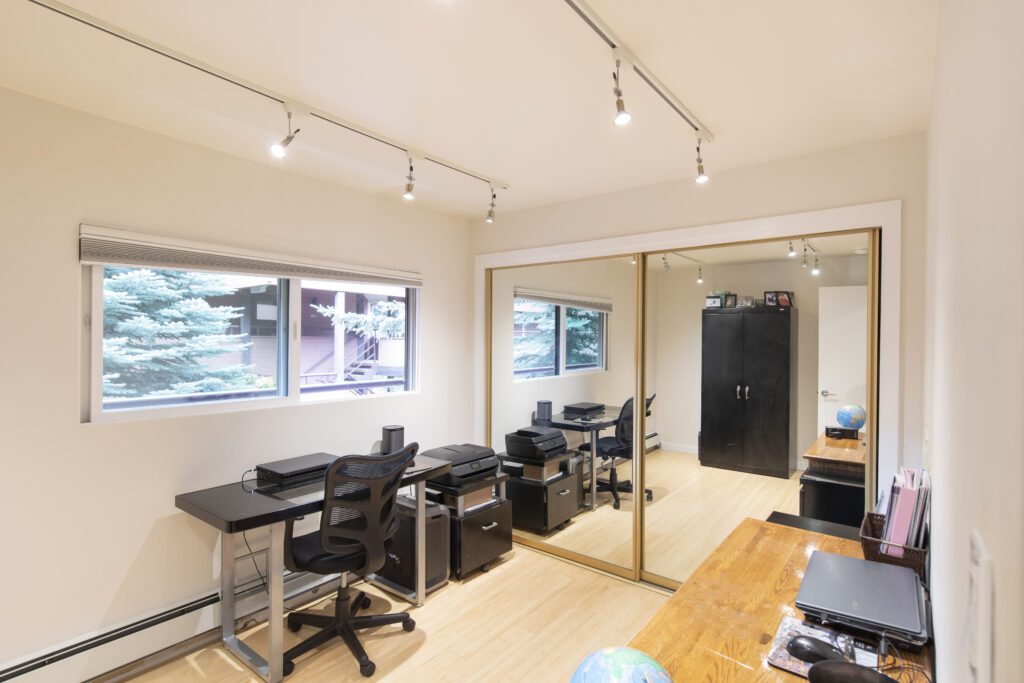 Office area with large mirrored closet doors at Vine development