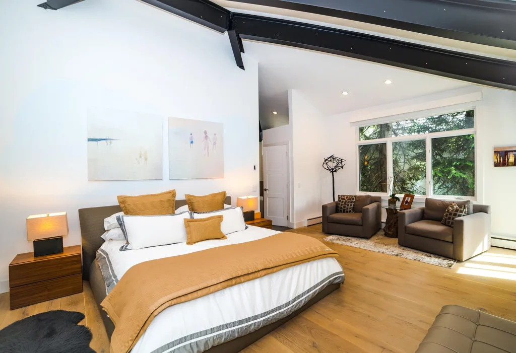 Master bedroom with slanted ceilings at Golf Lane