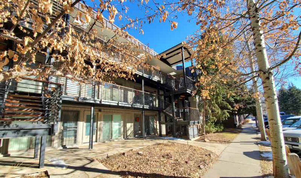 Exterior of Cooper Ave development in fall time with leaves