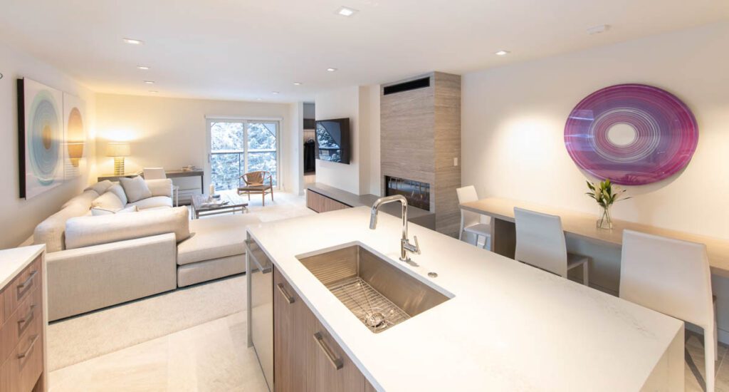 Interior view of kitchen area overlooking living area at Cooper Ave