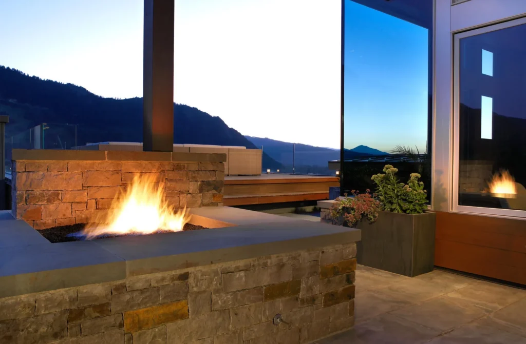 Exterior stone fire pit at Smuggler Mountain Residence