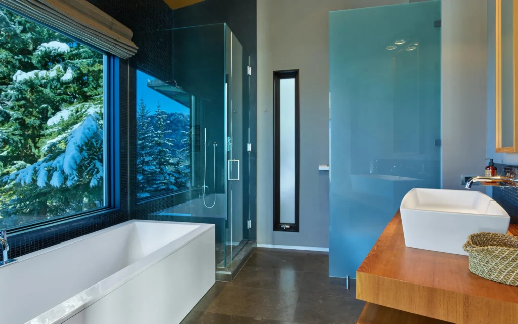 Interior bathroom view angled toward shower and bathtub at Smuggler Mountain Residence