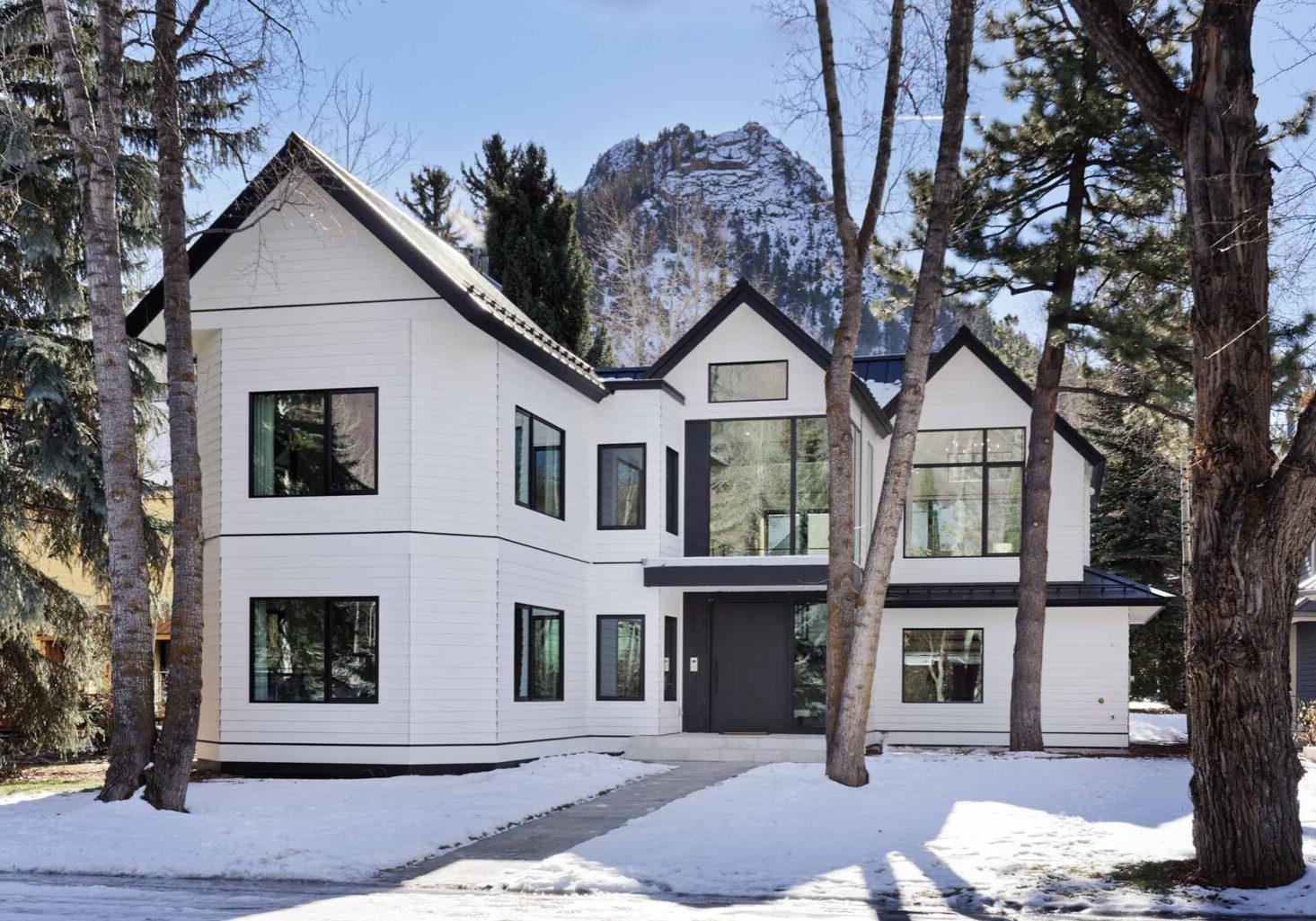 Exterior front view of Hallam development and snowy mountains in background